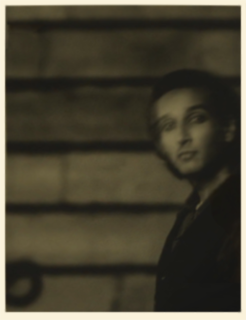 Blurry photograph of Assad as Armand, the same one we see in 2x4.